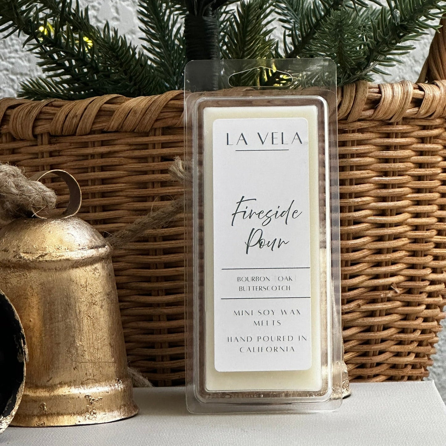 La Vela wax melt packaging on a surface with decorative items in the background